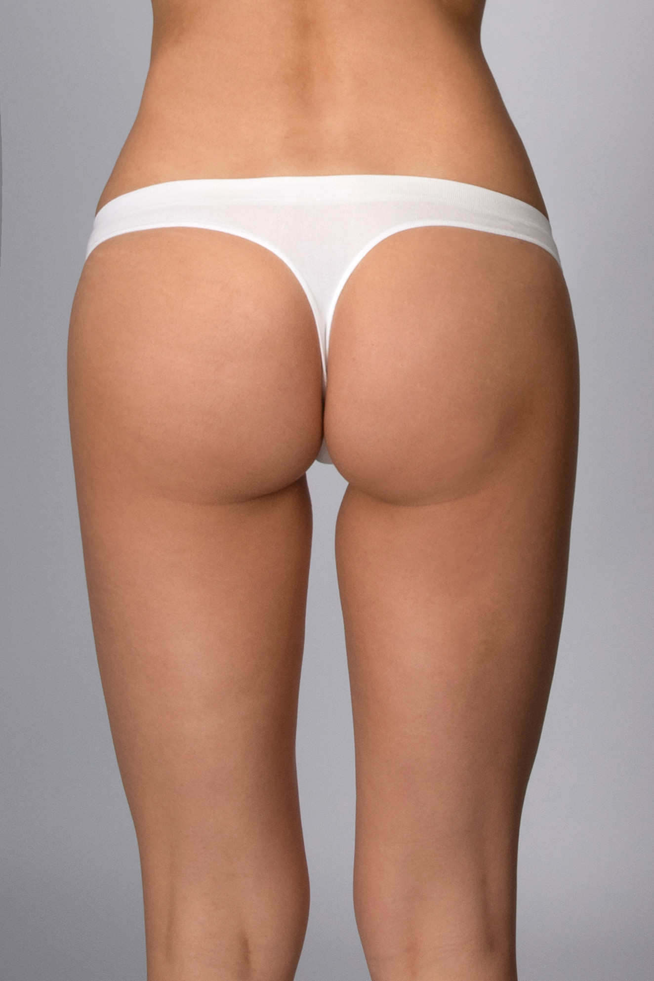 Kalhotky tanga s nízkým pasem bezešvé Perizoma vita bassa Intimidea Barva: Bílá, velikost M/L