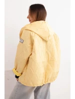 Dámská jarní prošívaná bunda s kapucí a zipem žlutá