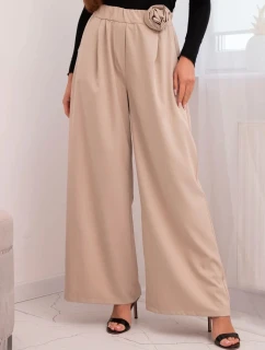 Dámské elegantní kalhoty s širokou nohavicí a ozdobným květem béžové