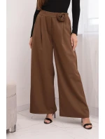 Dámské kalhoty elegantní se širokou nohavicí a ozdobným květem světle hnědé Dámské kalhoty elegantní se širokou nohavicí a ozdobným květem světle hnědé
