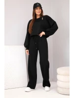 Dámský komplet máslová mikina s broží a kalhoty s rovnými nohavicemi černý