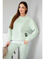 Dámský komplet s máslovou barvou, volnou mikinou a tepláky jasně mátová