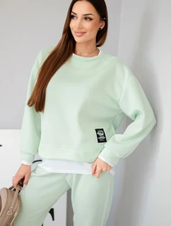 Dámský komplet s máslovou barvou, volnou mikinou a tepláky jasně mátová