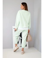 Dámský komplet s máslovou barvou, volnou mikinou a tepláky jasně mátová