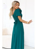 653-1 Elegantní dlouhé šaty s růží, páskem a vysokým rozparkem - lahvově zelené