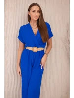Kombinéza s ozdobným páskem v pase chrpově modrá Kombinéza s ozdobným páskem v pase chrpově modrá