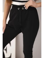 Dámské tepláky s elastickým pasem a šňůrkou černé