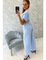 Kombinéza s ozdobným páskem v pase modrá Kombinéza s ozdobným páskem v pase modrá