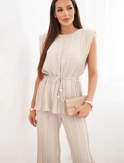 Dámský viskózový plisovaný komplet s vázanou halenkou a širokými kalhotami béžový