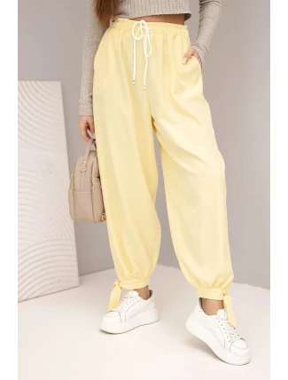 Dámské kalhoty s širokým nohavicím a zavazováním dole žluté