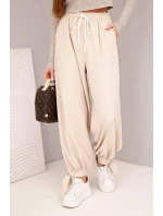 Dámské kalhoty s širokým nohavicí a vázáním dole béžové