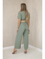 Kombinéza s ozdobným páskem v pase světlá khaki