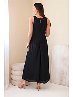 Dámský komplet z viskózy s topem bez rukávů a širokými kalhotami s ozdobným zakončením černý Dámský komplet z viskózy s topem bez rukávů a širokými kalhotami s ozdobným zakončením černý