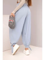 Dámské kalhoty s širokými nohavicemi a zavazováním dole džínové modré