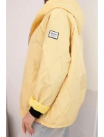 Dámská jarní prošívaná bunda s kapucí a zipem žlutá