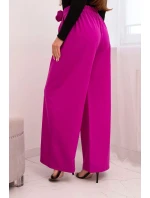 Dámské elegantní kalhoty se širokou nohavicí a ozdobným květem tmavě fialové Dámské elegantní kalhoty se širokou nohavicí a ozdobným květem tmavě fialové