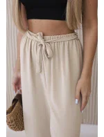 Kalhoty s širokým pasem beżowy