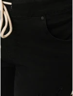 Černé dámské kalhoty FashionStreet s dírou UY2857