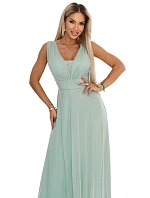 637-5 Dlouhé maxi šaty s brokátovým akcentem a hlubokým výstřihem - pistáciová barva