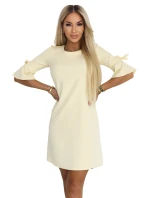 217-12 NEVA Dámské trapézové šaty s vázáním na rukávech - pastelově žluté 217-12 NEVA Dámské trapézové šaty s vázáním na rukávech - pastelově žluté