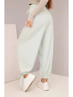 Dámské kalhoty se širokými nohavicemi a zavazováním dole tmavě mátové