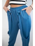 Kalhoty s ozdobnými proužky máslové látky džínovina