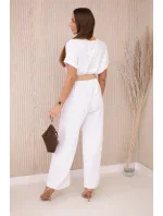 Kombinéza s ozdobným páskem v pase bílý Kombinéza s ozdobným páskem v pase bílý