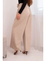 Dámské elegantní kalhoty s širokou nohavicí a ozdobným květem béžové