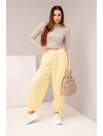 Dámské kalhoty s širokým nohavicím a zavazováním dole žluté