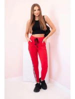 Dámské teplákové kalhoty s lampasem a šňůrkou v pase červené