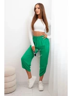 Kalhoty se širokými nohavicemi a kapsami zelený