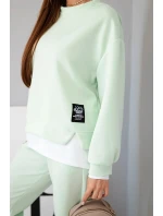 Dámský komplet s máslovou barvou, volnou mikinou a tepláky jasně mátová