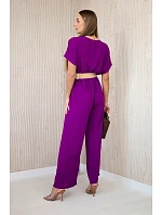 Kombinéza s ozdobným páskem v pase tmavě fialová Kombinéza s ozdobným páskem v pase tmavě fialová