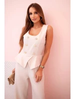 Dámská kombinéza bez rukávů s širokými nohavicemi a ozdobnými knoflíky béžový Dámská kombinéza bez rukávů s širokými nohavicemi a ozdobnými knoflíky béžový