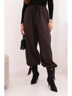 Dámské kalhoty s širokými nohavicemi a zavazováním na spodku hnědé