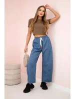 Máslové kalhoty zavazované v pase džínový melír Máslové kalhoty zavazované v pase džínový melír