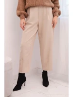 Dámské kalhoty s vysokým pasem a sklady béžové Dámské kalhoty s vysokým pasem a sklady béžové