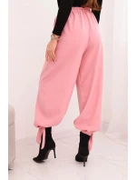 Dámské kalhoty s širokým nohavicí a vázáním dole světle růžové