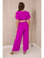 Kombinéza s ozdobným páskem v pase fialová