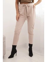 Dámské kalhoty z bavlny s vázáním v pase a zúženými nohavicemi béžové